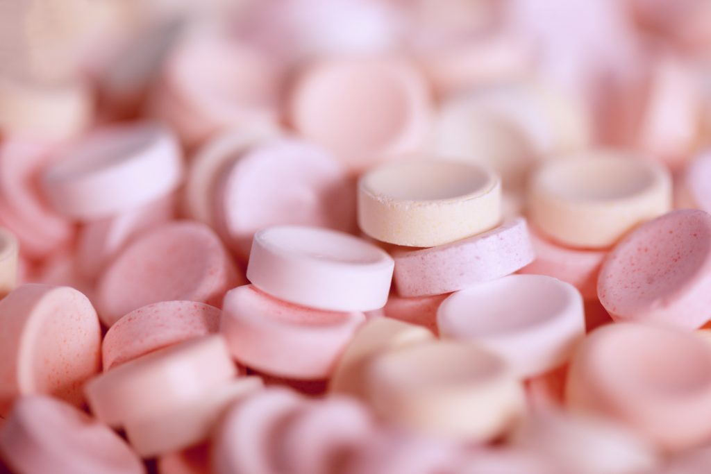 small rounded pink tablets 