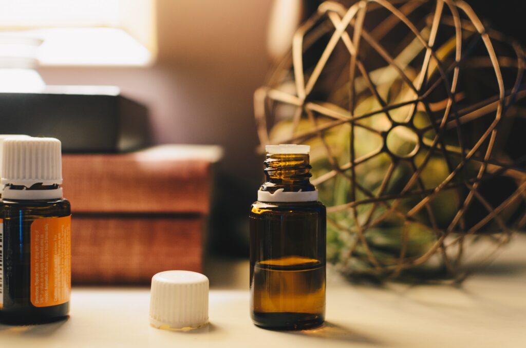 Image of two bottles of oil on a shelf