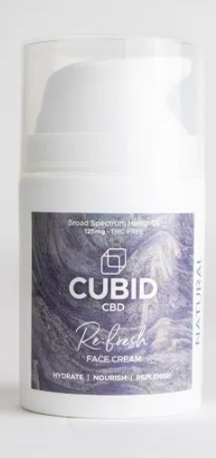 A white bottle of Cubid CBD with a purple sticker on it