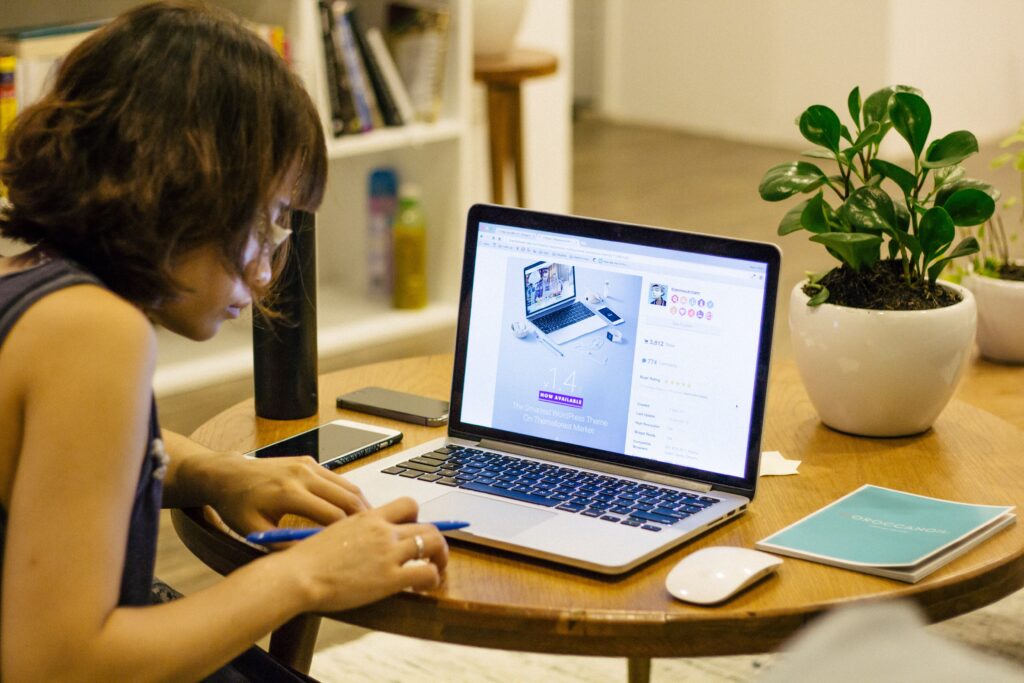 A woman sitting in front of a computer studying