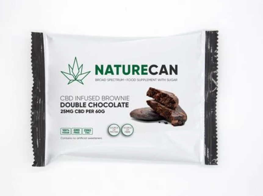 A brownie wrapped in white and black packaging from Naturecan